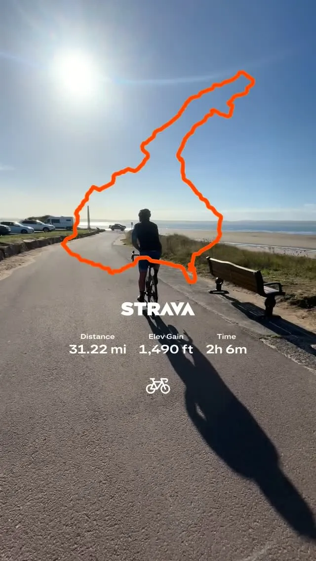 An EndureOne rider on a sunny coast path, with the Strava outline of a 31 mile route over the sky